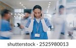 Nurse, woman and headache in hospital with stress of medical mistake, overworked and burnout. Motion blur, healthcare worker and migraine in busy clinic with fatigue, crisis and frustrated for chaos