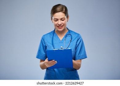 Nurse Woman Writing On Clipboard. Isolated Portrait.