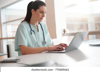 Nurse Working On Laptop Computer                    