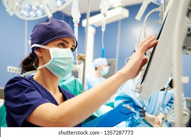 Nurse Working With Technology In Operating Room