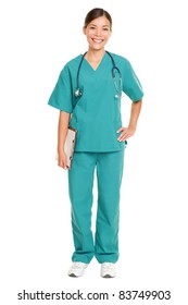 Nurse Or Young Doctor Standing Smiling Isolated On White Background In Full Body. Woman Medical Professional In Green Scrubs Smiling Happy. Mixed Race Ethnic Chinese Asian And Caucasian Female Model.