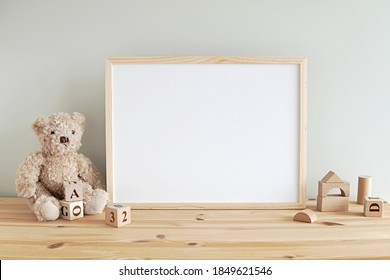 Nursery frame mockup, empty wooden horizontal frame for baby room or kids room wall art, print, photo.     - Shutterstock ID 1849621546