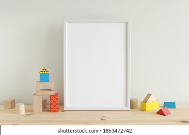 Nursery Or Kids Room Art Frame Mockup, Vertical Empty White Frame And Colorful Toys Building Blocks On Wooden Shelf.