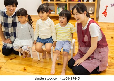 Nursery Teacher And Child Portrait