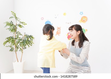 Nursery Teacher And Girls Image