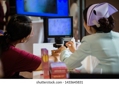 Nurses with fingerprint technology to patient. - Shutterstock ID 1433645831
