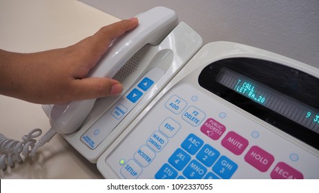 Nurse's Hand Holding Phone From Electronic Communication Equipment.Equipment For Nurse Or Staff When Patient Call For Help.