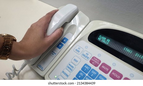 Nurse's Hand Holding Phone From Electronic Communication Equipment.Equipment For Nurse Or Staff When Patient Call For Help