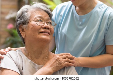 Nursing Home With Caregiver And Old Lady Resident Concept.Care Giver Hand On Happy Elderly Senior Patient To Comfort In Hospital Or Hospice Nursing Home Or Hospice .Public Service Recognition Week