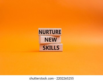 Nurture New Skills Symbol. Concept Words Nurture New Skills On Wooden Blocks. Beautiful Orange Background. Business And Nurture New Skills Concept. Copy Space