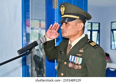Nusalaut, Indonesia - August 17, 2022: A Member Of The Indonesian National Armed Forces Pays Respects During A Ceremony