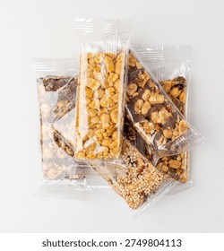 Nut Bar in Plastic Package Isolated, Energy Snack with Nuts, Muesli, Protein Candy Bar, Fitness Fruit and Nut Mix on White Background, Clipping Path