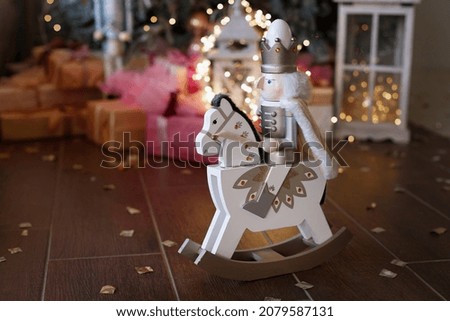 Nutcracker Christmas d cor on the background of the Christmas tree. postcard for the new year. free space for text