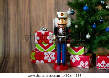 Nutcracker with Christmas Present and  Christmas Tree