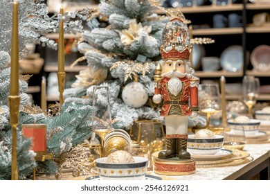 Nutcracker figurine on a table decorated for Christmas. A close-up of the Nutcracker on a table in a store