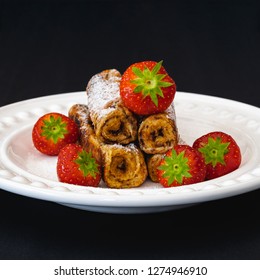 Nutella French Toast Rolls With Strawberries Isolated On Black Background