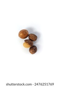 Nutmeg in Nutmeg Shell on white Background - Isolated. Top view