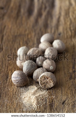 Similar – Dried poppy seed capsules on an old metal plate