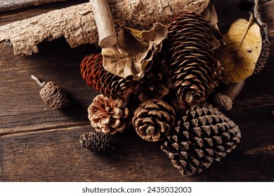 nut,pine cones and colorful fall leaves on wooden background - Powered by Shutterstock