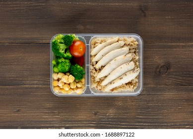 Nutrient Dense Healthy Low Fat Food In Takeaway Meal Box Set On Wood Background Top View