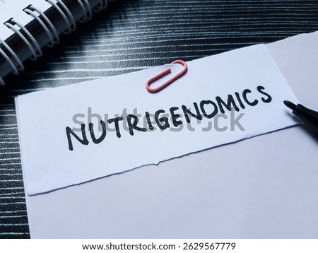 Nutrigenomics writting on table background.