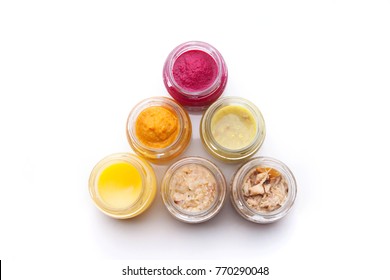 Nutrition concept - Healthy food, Diet, Detox, Clean Eating or Vegetarian concept. A set of nutritious food on small glass jars against white background. Sample food in glass jars.  Top view