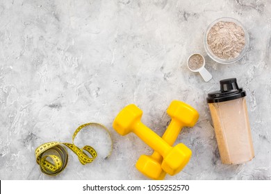 Nutrition For Workout With Protein Cocktail, Powder And Bars On Stone Background Top View Mockup