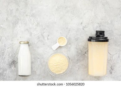 Nutrition For Workout With Protein Cocktail, Powder And Milk On Stone Background Top View Mockup