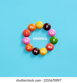 Nutritional mineral supplements. Health care. Minerals, body health and dieting. Essential Mineral symbols for body care on colorful pills.