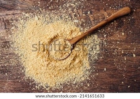 Nutritional yeast flakes, or inactive yeast.