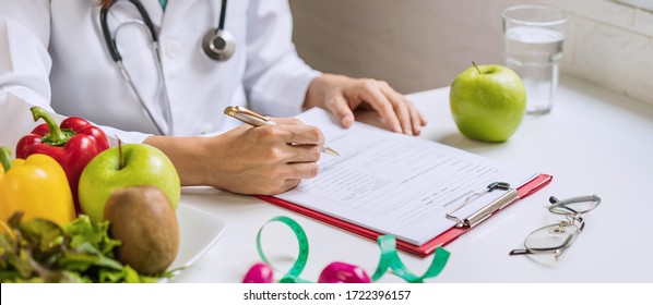 Nutritionist Giving Consultation To Patient With Healthy Fruit And Vegetable, Right Nutrition And Diet Concept