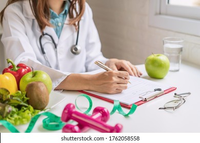 Nutritionist Giving Consultation To Patient With Healthy Fruit And Vegetable, Right Nutrition And Diet Concept