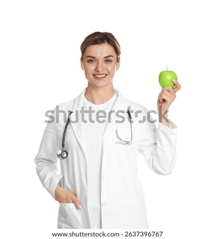 Nutritionist with green apple and stethoscope on white background