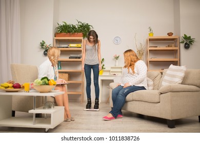 nutritionist office slim paient standing on scales