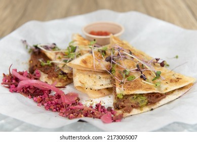 Nutritious cheese quesadilla with BBQ jerk jackfruit on a tortilla will start any day with a nutrional boost.