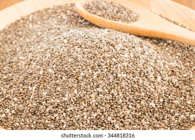 Nutritious chia seeds on a wooden plate, stock photo - Shutterstock ID 344818316