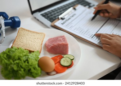 Nutritious food with fresh vegetable, meat and egg for healthy diet on white table