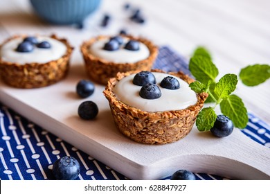 Nutritious Granola Cups Filled With Yoghurt And Blueberry