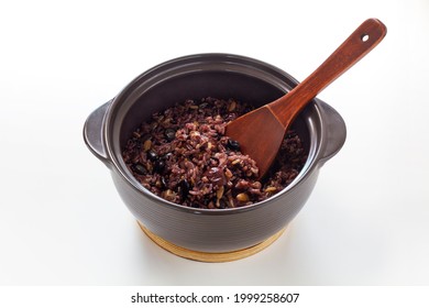 Nutritious hot stone pot rice with mushroom, miscellaneous cereals, jujube, and pine nut. Isolated on white background.
 - Shutterstock ID 1999258607