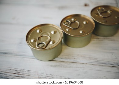Nutritious meal for your little buddy. Tin cans of pet food on a white board background. Pet care and veterinary concept