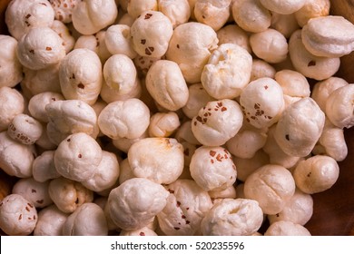 Nutritious roasted Makhana Namkeen or Fox Seed, which is a part of Lotus Flower. Served in a bowl over colourful or wooden background. Selective focus