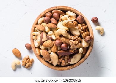 Nuts Assortment In A Bowl On White Top View.