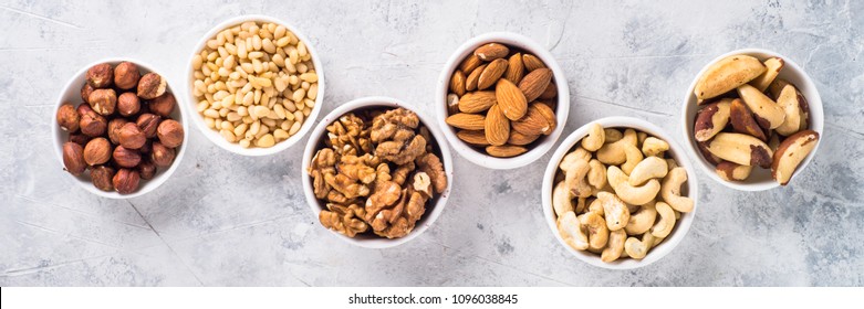 Nuts Assortments On Stone Table Top View.