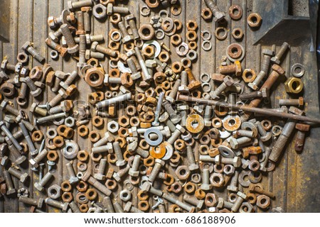 Nuts and bolts closeup on plain background