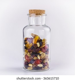 Nuts And Dried Fruit Mix In A Glass Jar, Closeup