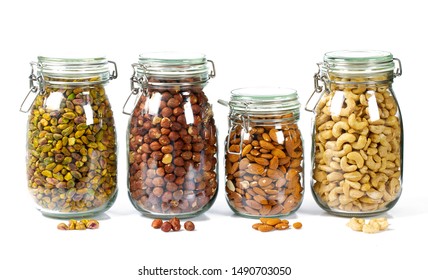 nuts in glass jars isolated on white - Powered by Shutterstock