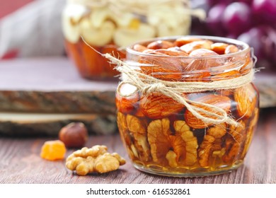 Nuts with honey in glass.