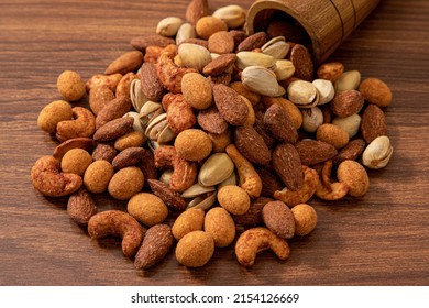 Nuts mix in a wooden table ,Mixed dry nuts .various nuts, grains sold - Shutterstock ID 2154126669