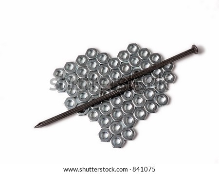 Nuts and nails in the shape of a heart on white background