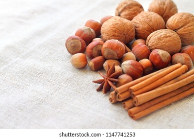 Nuts and spices on sacking background